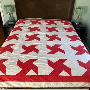 Vintage thrashed hand quilted quilt in red & white star pattern